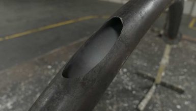 What are the Two Different Types of Wear in Pneumatic Conveying Elbows?